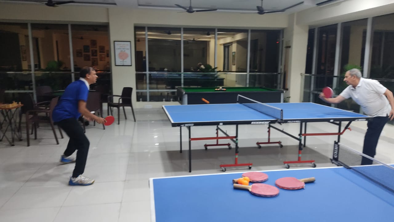 Table tennis match at an indoor sports facility